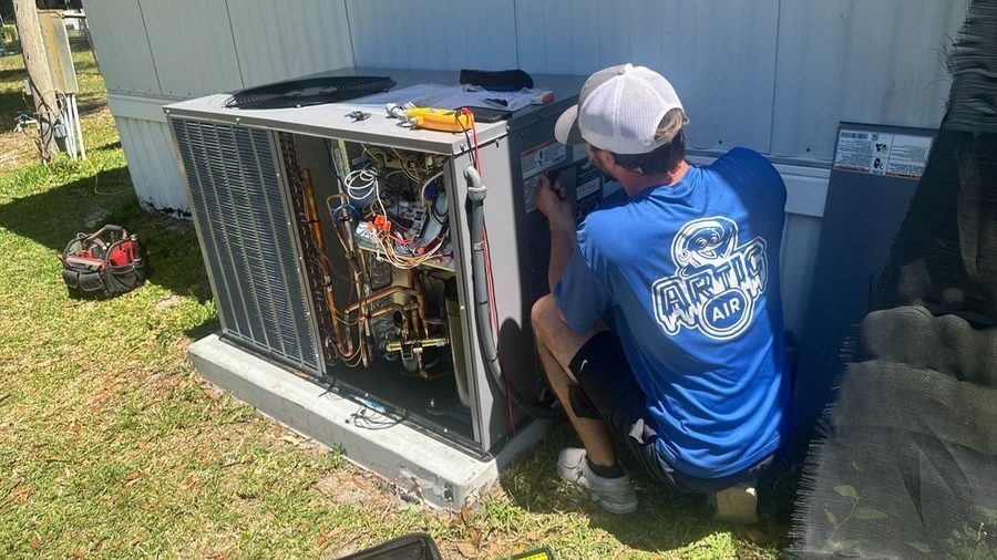 Artic Air technician performing an AC tune-up